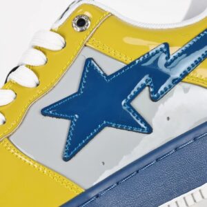 a bathing ape sta low sneaker in yellow and blue
