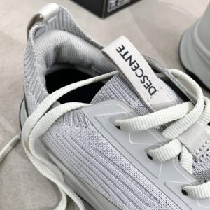 descente white sports shoes