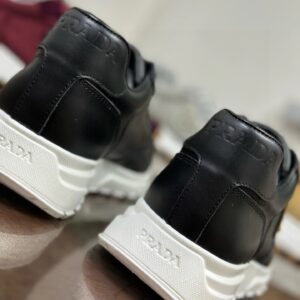 prada prax 2.0 leather sneakers black white