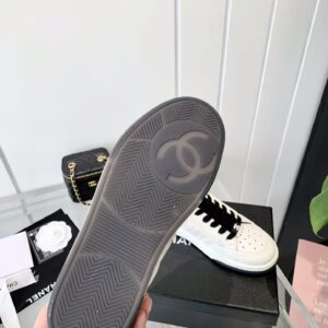 chanel white sneakers embossed logo