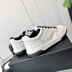 chanel white sneakers embossed logo